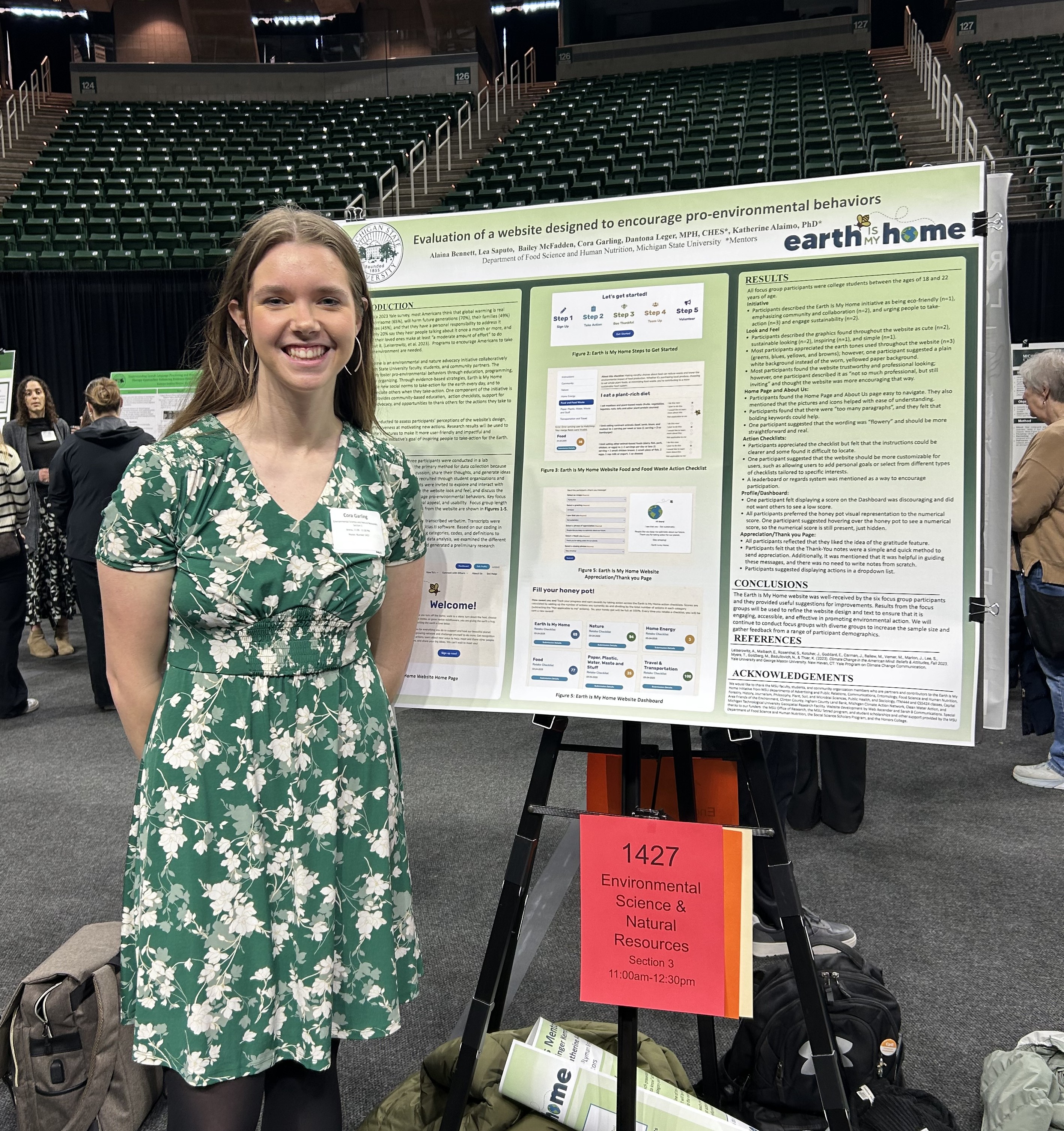 A photo of Cora Garling standing in front of a poster at UURAF